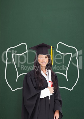 Happy graduate student woman with fists graphic standing against green blackboard