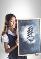 Girl holding blackboard with light bulb energy