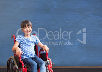 Disabled girl in wheelchair in front of blackboard