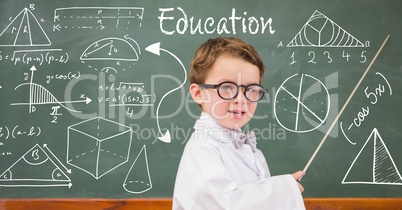 Boy teacher explaining diagrams on blackboard