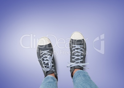 Grey shoes on feet with purple background