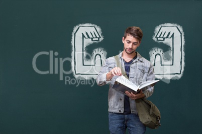 Student man with fists graphic reading against green blackboard