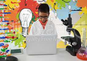 Schoolboy scientist in lab with colorful light bulbs background