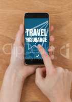Person using a phone with travel insurance concept on screen
