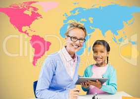 Kid and teacher holding tablet in front of colorful world map
