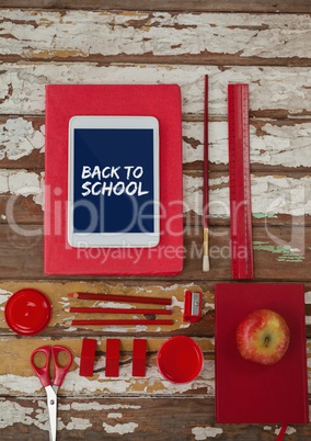 Tablet on a school table with back to school text on screen