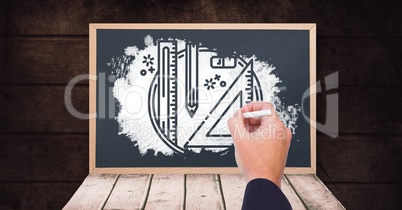 Hand drawing stationery on blackboard with chalk