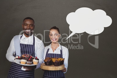 Small business owners couple with speech bubble holding cupcakes against grey background