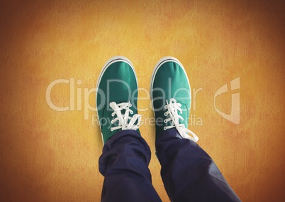 Green shoes on feet with rustic background