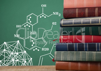 Stack of books next to blackboard with science diagrams