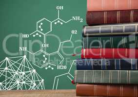 Stack of books next to blackboard with science diagrams