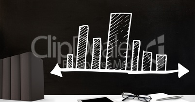 Desk foreground with blackboard graphics of bar charts incremental stretching