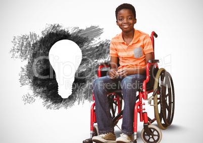 Disabled boy in wheelchair next to charcoal light bulb
