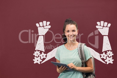 Happy student woman with fists graphic standing against red blackboard