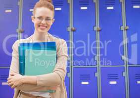 female student holding files in front of lockers