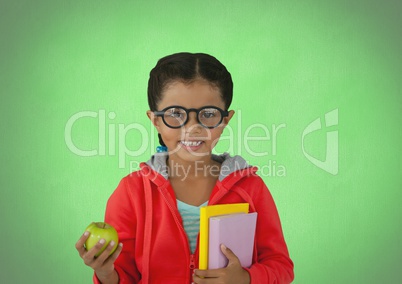 Girl with apple and books in front of green background