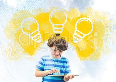 Boy on tablet under light bulbs