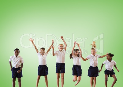 Multicultural Kids jumping in front of green background