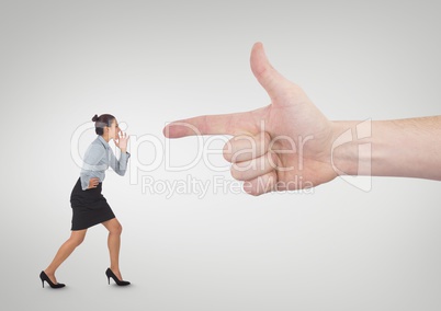 Hand pointing at angry business woman against white background