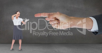 Hand pointing at surprised business woman against grey background