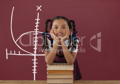 Student girl at table against red blackboard with education and school graphic