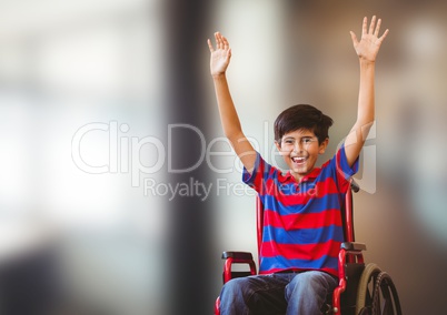 Disabled boy in wheelchair in front of blurred background