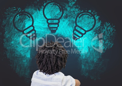 Boy looking at light bulb graphics