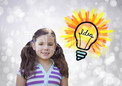 Girl with colorful idea light bulb and sparkling lights bokeh background