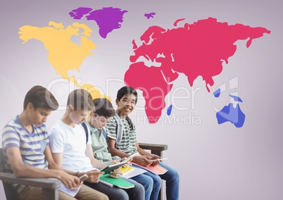 Kids sitting in front of colorful world map