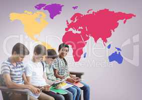 Kids sitting in front of colorful world map