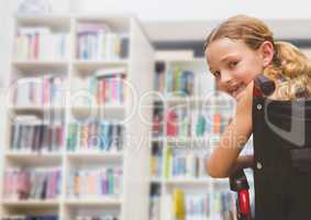 Disabled girl in wheelchair in school library