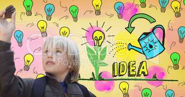 Boy looking at pine cone with colorful idea light bulbs graphics