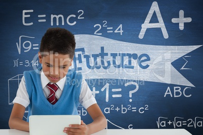 Student boy at table using a tablet against blue blackboard with future text