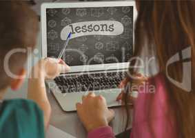 Kids using a computer with school icons on screen