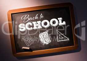 Back to school text on blackboard with chalk and stationery