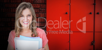 Composite image of smiling hipster holding notebook