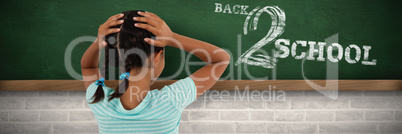 Composite image of rear view of girl with hands on head