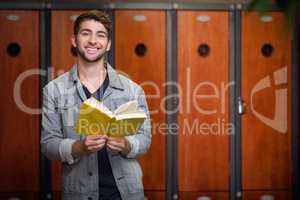 Composite image of student smiling at camera in library