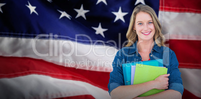 Composite image of smiling student holding notebook and file