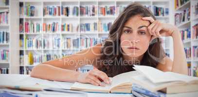 Composite image of bored student doing her homework