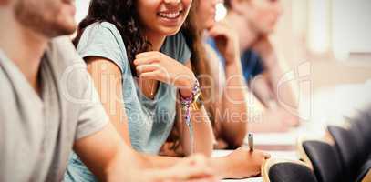 Smiling students listening lecturer