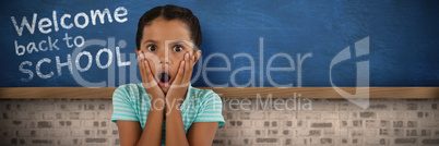 Composite image of portrait of surprised girl with head in hands