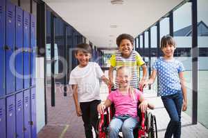 Composite image of cute disabled pupil smiling at camera with her friends