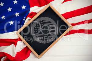 Composite image of cropped hand holding tool and american flag on red poster