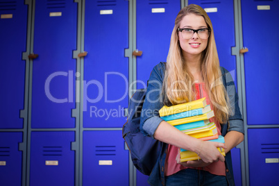 Composite image of pretty student in the library