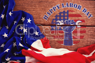 Composite image of happy labor day text over cropped hand holding tools