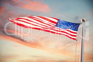 Composite image of american flag waving over white background