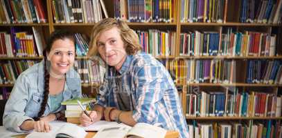 Composite image of college students doing homework in library