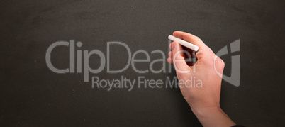 Composite image of man drawing on chalkboard