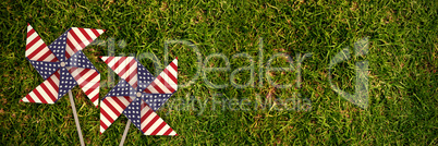 Composite image of 3d image of pinwheel toy with american flag pattern